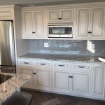 marble countertops with high end white cabinetry